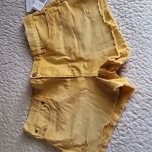 Cut off yellow denim shorts